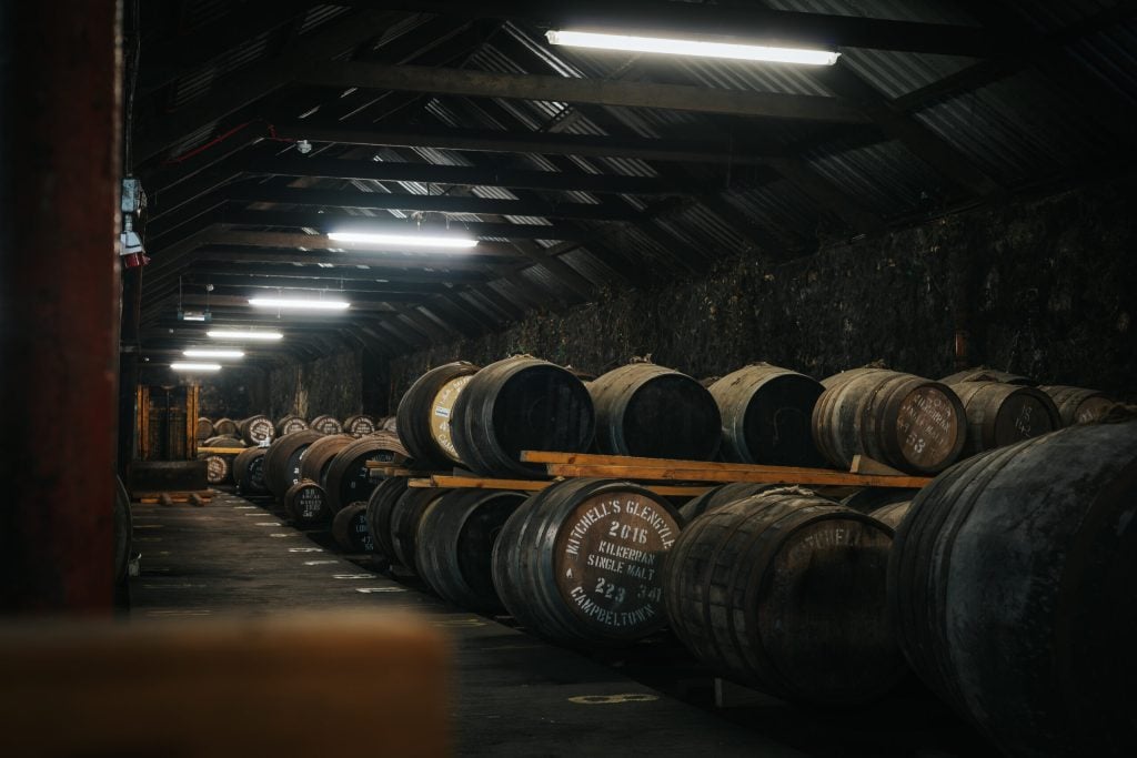 Rows of whisky casks maturing in the Cadenhead's warehouse in Campbeltown